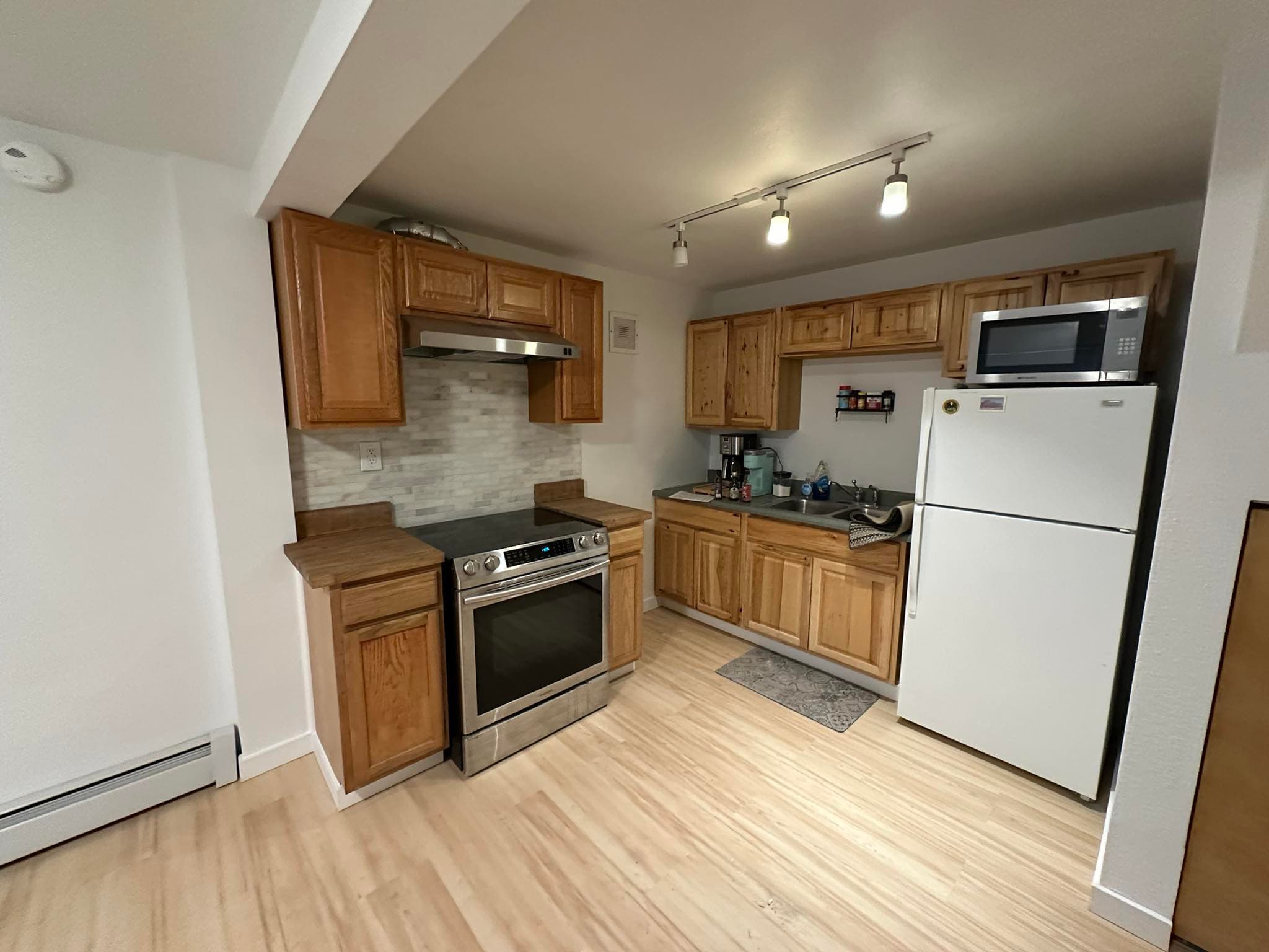 Complete kitchen renovation with oak cabinets and new flooring