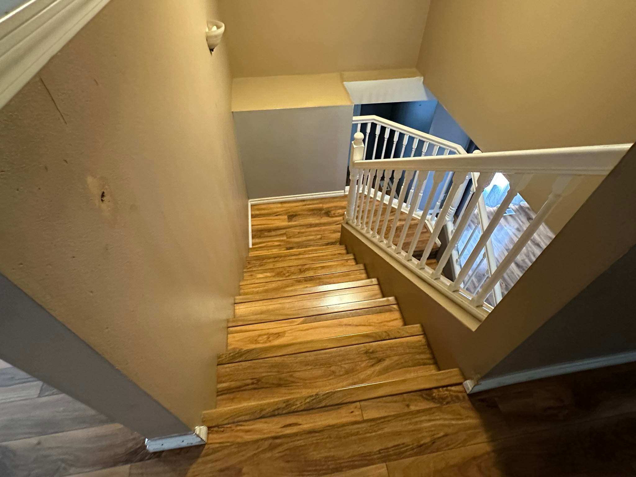 Top-down view of hardwood staircase with natural wood grain